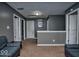 Upstairs hallway with neutral walls and carpet and access to multiple rooms at 11303 Cuyahoga Dr, Indianapolis, IN 46235