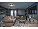 Inviting living room featuring neutral tones, comfortable seating, and modern entertainment center at 11303 Cuyahoga Dr, Indianapolis, IN 46235
