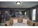 Living room with an open layout, comfortable sofa, and view into the kitchen at 11303 Cuyahoga Dr, Indianapolis, IN 46235
