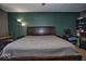 Spacious main bedroom featuring carpeting, neutral paint, and comfortable furniture at 11303 Cuyahoga Dr, Indianapolis, IN 46235
