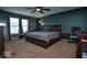 Serene main bedroom featuring a ceiling fan, carpeting, and windows with natural light at 11303 Cuyahoga Dr, Indianapolis, IN 46235