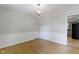 Elegant dining room with hardwood floors, chandelier, and white wainscoting; open to other living spaces at 11461 N College Ave, Carmel, IN 46032