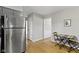 Bright kitchen featuring stainless refrigerator and seating for two at 11461 N College Ave, Carmel, IN 46032