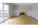 Bright living room featuring fireplace, built-ins, and sliding doors at 11461 N College Ave, Carmel, IN 46032