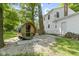 Backyard featuring a unique wooden sauna, white home, and a landscaped yard at 11461 N College Ave, Carmel, IN 46032
