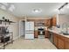 Functional kitchen boasts stainless steel appliances, ample counter space, and stylish cabinetry at 11521 Short Iron Ln, Indianapolis, IN 46235