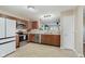 Functional kitchen boasts stainless steel appliances, ample counter space, and stylish cabinetry at 11521 Short Iron Ln, Indianapolis, IN 46235