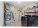 This laundry room includes a washer and dryer, and is equipped with shelves, a water heater, and a furnace at 11521 Short Iron Ln, Indianapolis, IN 46235