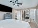 Spacious bedroom with a ceiling fan, closet, dresser and an ensuite bathroom offers a private and comfortable retreat at 11521 Short Iron Ln, Indianapolis, IN 46235