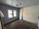 Bedroom with window, unfinished walls, and hardwood floors at 1201 N Canal St, Alexandria, IN 46001