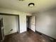 Bedroom with closet, two windows and wood flooring at 1201 N Canal St, Alexandria, IN 46001