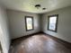 Bedroom with two windows and hardwood floors at 1201 N Canal St, Alexandria, IN 46001