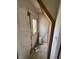 This is an entryway featuring a door with a diamond-shaped window and evidence of needed repair at 1201 N Canal St, Alexandria, IN 46001
