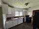 Kitchen with white cabinets, wood countertops, and window at 1201 N Canal St, Alexandria, IN 46001