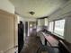 Kitchen with white cabinets, wood countertop, and black refrigerator at 1201 N Canal St, Alexandria, IN 46001