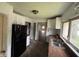 An older kitchen with white cabinets and a double basin sink, awaiting renovation and updates at 1201 N Canal St, Alexandria, IN 46001