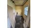An unfinished laundry room with exposed wiring and space for appliances, awaiting renovation at 1201 N Canal St, Alexandria, IN 46001
