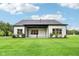 Expansive backyard with green grass and a covered patio, perfect for outdoor entertaining at 12594 Pasco St, Fishers, IN 46038