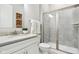 Bathroom featuring a glass enclosed shower, granite vanity top, and tiled floors at 12594 Pasco St, Fishers, IN 46038