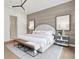 Elegant bedroom with a stylish accent wall, modern furniture, and cozy rug at 12594 Pasco St, Fishers, IN 46038