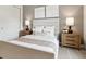 Bedroom boasts a cozy ambiance with neutral tones, soft lighting, and two large windows for natural light at 12594 Pasco St, Fishers, IN 46038