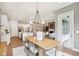 Open concept dining room, kitchen, and living room area with modern decor and layout at 12594 Pasco St, Fishers, IN 46038