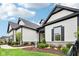 Beautifully landscaped modern home with elegant architectural features and a walkway at 12594 Pasco St, Fishers, IN 46038