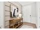 Inviting foyer featuring stylish console table, modern art, and wood floors at 12594 Pasco St, Fishers, IN 46038