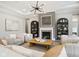 Spacious living room with fireplace, modern lighting, and stylish seating arrangement at 12594 Pasco St, Fishers, IN 46038