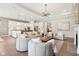 Open-concept living room featuring a stylish kitchen, modern decor, and hardwood floors at 12594 Pasco St, Fishers, IN 46038