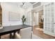 The office features hardwood flooring, recessed lighting, modern chandelier, and adjacent to the kitchen at 12594 Pasco St, Fishers, IN 46038