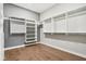 Spacious walk-in closet with custom shelving and hardwood flooring for organized storage at 12594 Pasco St, Fishers, IN 46038