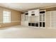 Finished basement featuring neutral walls, carpeted floors, and built-in shelving at 13091 Duval Dr, Fishers, IN 46037