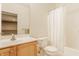 Bathroom featuring a wood vanity, toilet and bathtub with shower at 13091 Duval Dr, Fishers, IN 46037