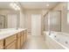 Bathroom with double sink vanity, soaking tub, and shower at 13091 Duval Dr, Fishers, IN 46037