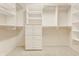Walk-in closet features custom shelving and carpeted floor at 13091 Duval Dr, Fishers, IN 46037