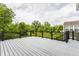 A well-kept deck looks out onto a lush yard and treeline at 13091 Duval Dr, Fishers, IN 46037