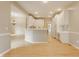 Open concept kitchen featuring white cabinets, stainless appliances, and a peninsula with breakfast bar at 13091 Duval Dr, Fishers, IN 46037