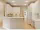 Modern kitchen featuring white cabinets, granite countertops, and stainless steel appliances at 13091 Duval Dr, Fishers, IN 46037