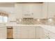 Bright kitchen with white cabinetry, stainless appliances, and stylish tile backsplash at 13091 Duval Dr, Fishers, IN 46037