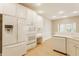 A full kitchen featuring stainless steel appliances and white cabinets, in an open-concept layout at 13091 Duval Dr, Fishers, IN 46037
