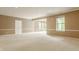 Bright living room featuring carpeted floors, neutral walls and a view to the sunroom at 13091 Duval Dr, Fishers, IN 46037