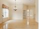 Light-filled living space featuring hardwood floors, elegant lighting, and an open layout at 13091 Duval Dr, Fishers, IN 46037