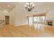 Spacious living room featuring gleaming hardwood floors, fireplace, bright windows, and ample natural light at 13091 Duval Dr, Fishers, IN 46037