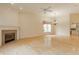 Open living area with wood floors, fireplace, ceiling fan, and windows offering natural light at 13091 Duval Dr, Fishers, IN 46037