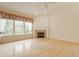 Light-filled living room boasts a fireplace, hardwood floors, crown molding, and neutral wall colors at 13091 Duval Dr, Fishers, IN 46037