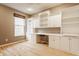 Bright office features custom built-in shelving and desk area at 13091 Duval Dr, Fishers, IN 46037