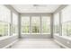 Sun-filled sun room featuring tiled floors, neutral paint, and large windows for natural light at 13091 Duval Dr, Fishers, IN 46037