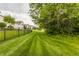 Well-manicured lawn bordering mature neighborhood trees at 13091 Duval Dr, Fishers, IN 46037