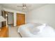 Cozy bedroom with soft lighting, double closets, neutral carpet, and a comfortable bed at 1324 N Stewart Rd, Anderson, IN 46012